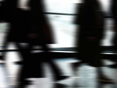 A person in motion, captured with a slight blur to show movement.